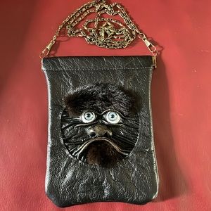 Leather Arts one of a kind face purse.